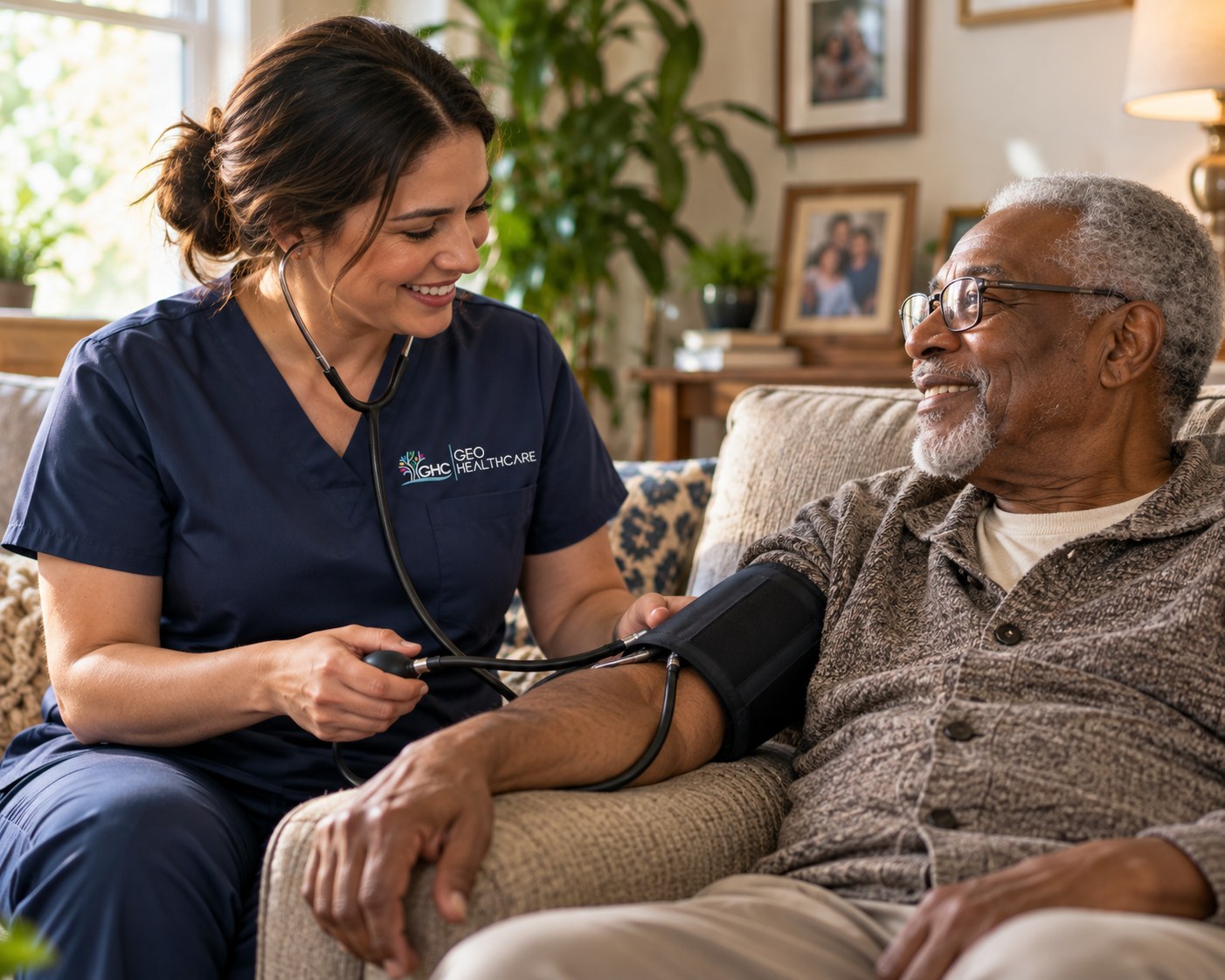 A Geo HealthCare nurse checking an older man's blood pressure in his living room